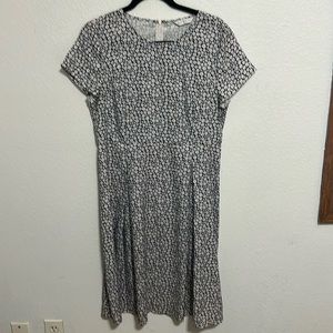 Light weight floral dress. Roomy through hips, front and back darts, unlined.